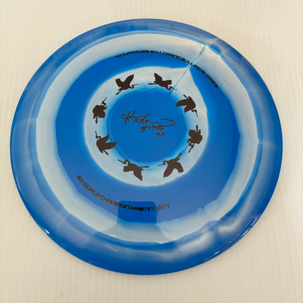 Latitude 64° 2025 Kristin Lätt Team Series Royal Grand Bullseye Grace 11/6/-1/2