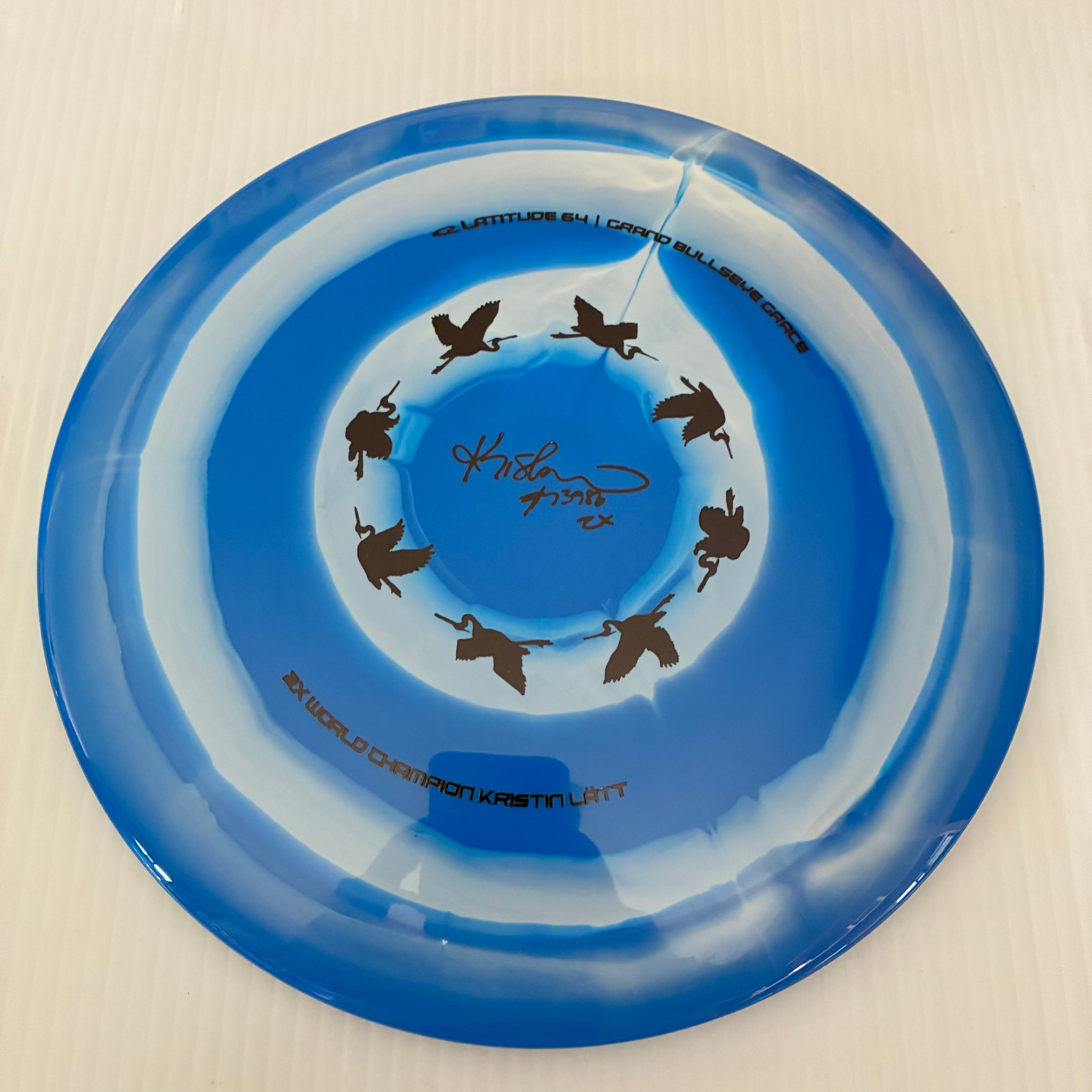 Latitude 64° 2025 Kristin Lätt Team Series Royal Grand Bullseye Grace 11/6/-1/2
