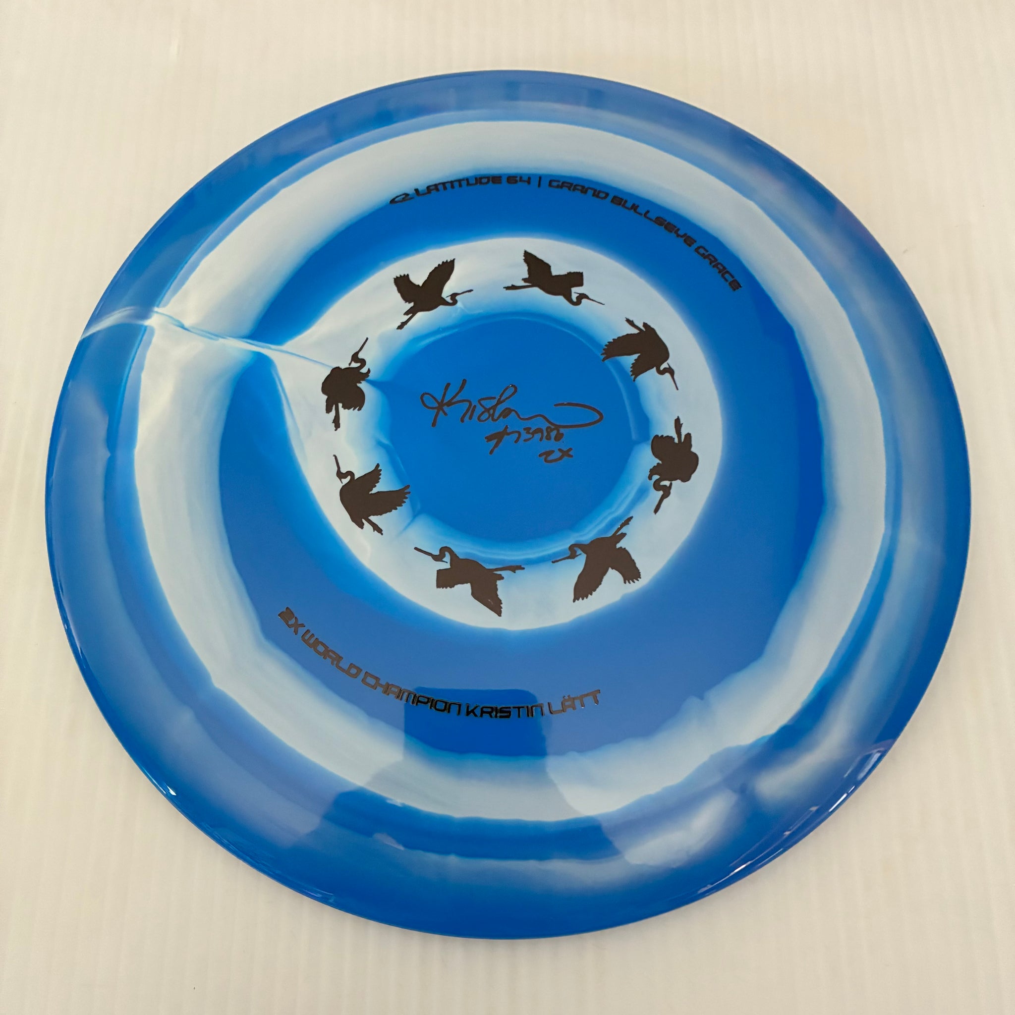 Latitude 64° 2025 Kristin Lätt Team Series Royal Grand Bullseye Grace 11/6/-1/2