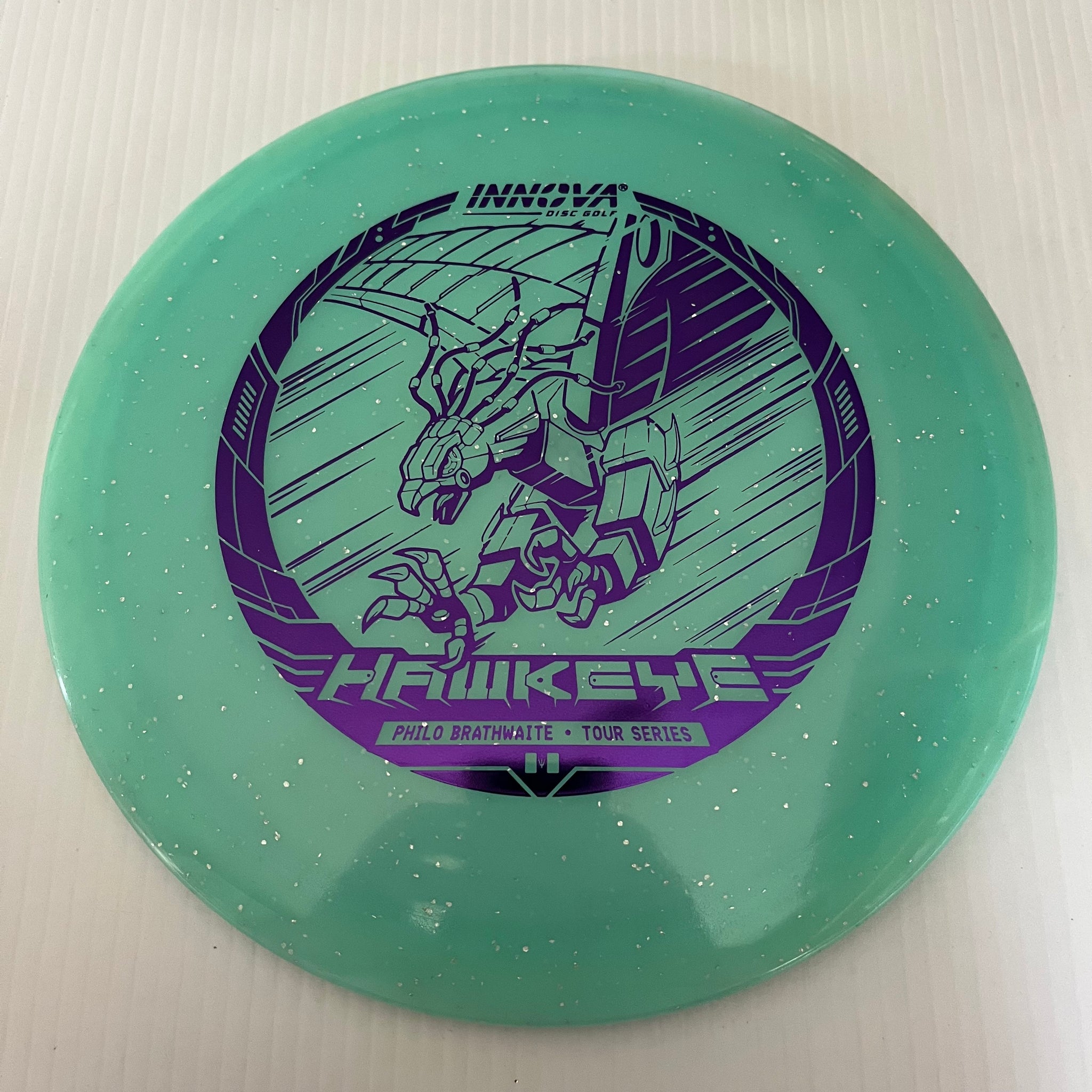 Innova 2023 Philo Brathwaite Tour Series Metal Flake Champion Glow Hawkeye 7/5/-1/1